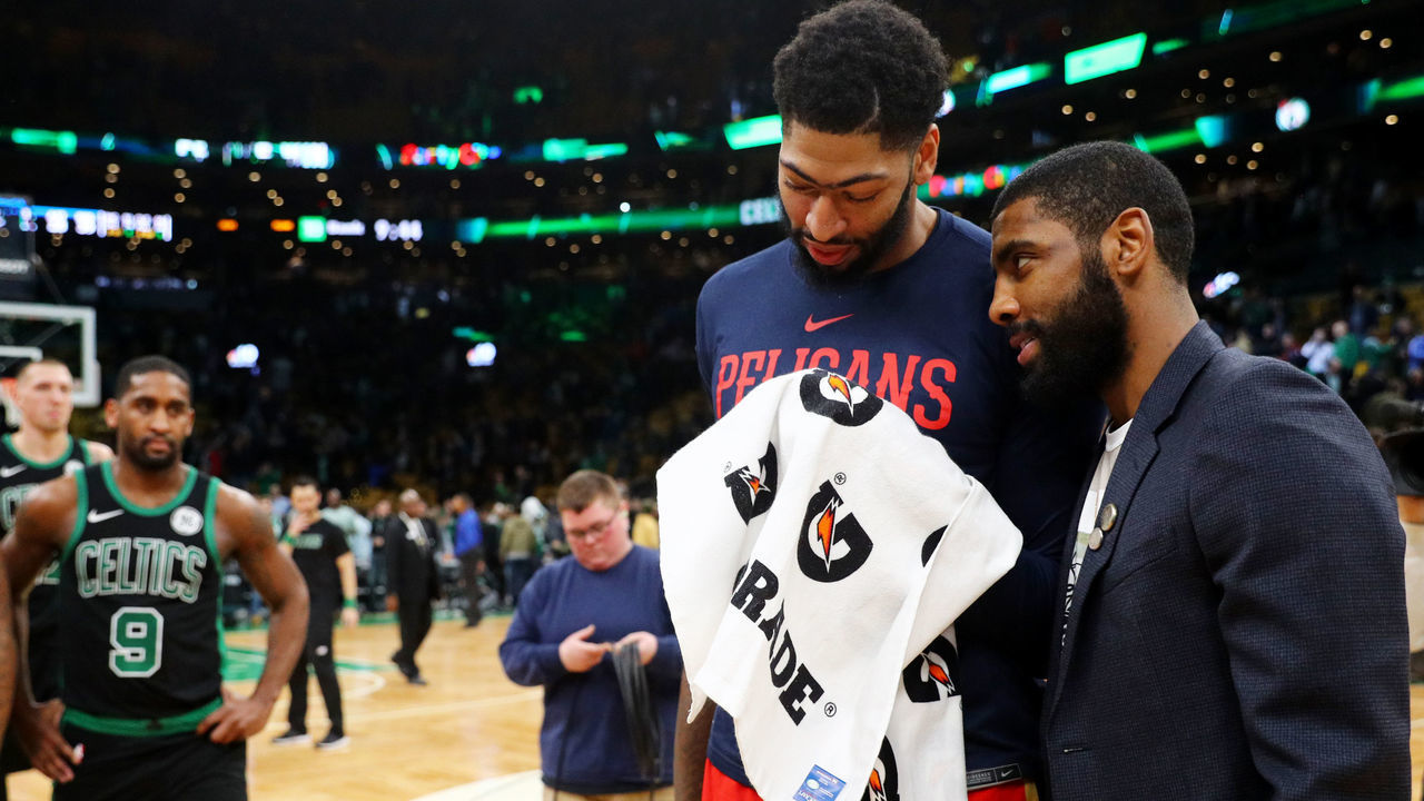 BOSTON, MA - DECEMBER 10: Kyrie Irving #11 of the Boston Celtics and Anthony Davis #23 of the New Orleans Pelicans talk after the game between the Celtics and Pelicans at TD Garden on December 10, 2018 in Boston, Massachusetts.