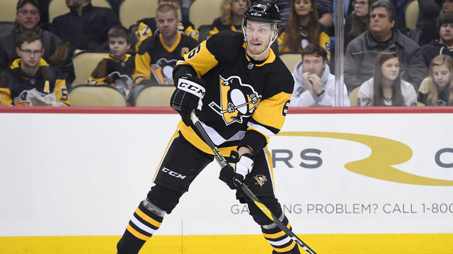 PITTSBURGH, PA - JANUARY 04: Pittsburgh Penguins Defenseman Jamie Oleksiak (6) passes the puck during the second period in the NHL game between the Pittsburgh Penguins and the Winnipeg Jets on January 4, 2019, at PPG Paints Arena in Pittsburgh, PA.