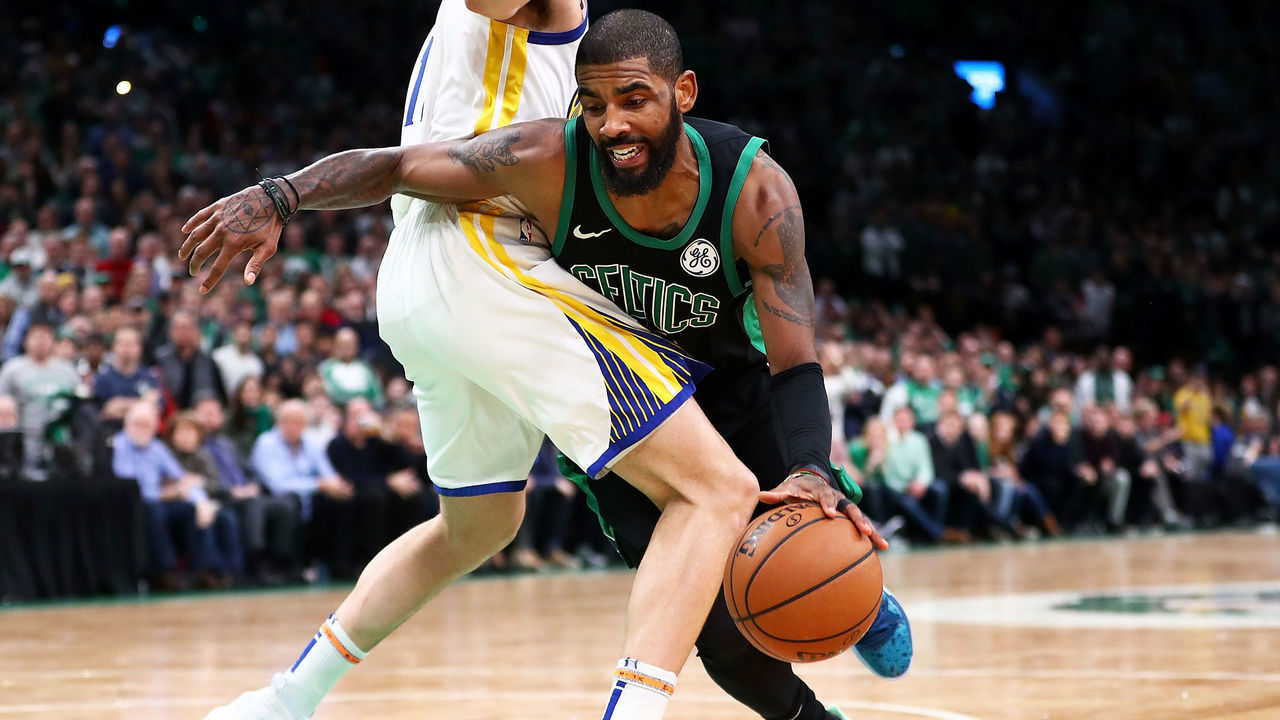 BOSTON, MA - JANUARY 26: Kyrie Irving #11 of the Boston Celtics drives to the basket during a game against the Golden State Warriors at TD Garden on January 26, 2019 in Boston, Massachusetts.