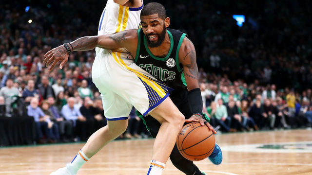 BOSTON, MA - JANUARY 26: Kyrie Irving #11 of the Boston Celtics drives to the basket during a game against the Golden State Warriors at TD Garden on January 26, 2019 in Boston, Massachusetts.