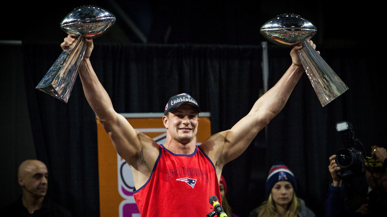 Providence, RI - FEBRUARY 07: New England Patriots tight end Rob Gronkowski (87) holds up two Lombardi Trophies during the Patriots Victory Rally at the Dunkin Donuts Center on February 7, 2017, in Providence, Rhode Island to celebrate winning Super Bowl LI.