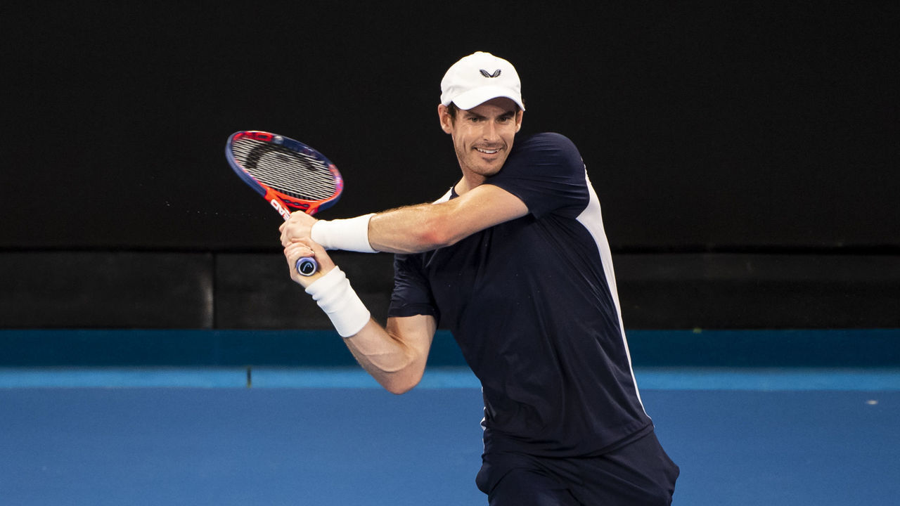 MELBOURNE, AUSTRALIA - JANUARY 14: Andy Murray of Great Britain hits a backhand in his first round match against Roberto Bautista Agut of Spain during day one of the 2019 Australian Open at Melbourne Park on January 14, 2019 in Melbourne, Australia.