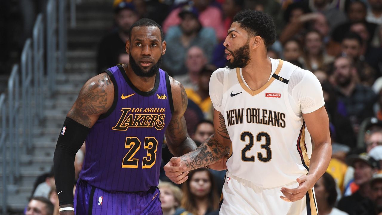 LOS ANGELES, CA - DECEMBER 21: LeBron James #23 of the Los Angeles Lakers and Anthony Davis #23 of the New Orleans Pelicans fight for position during a game on December 21, 2018 at STAPLES Center in Los Angeles, California. NOTE TO USER: User expressly acknowledges and agrees that, by downloading and/or using this Photograph, user is consenting to the terms and conditions of the Getty Images License Agreement. Mandatory Copyright Notice: Copyright 2018 NBAE