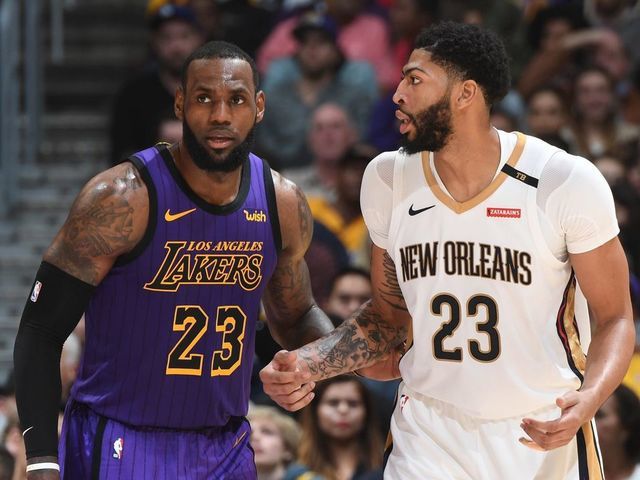LOS ANGELES, CA - DECEMBER 21: LeBron James #23 of the Los Angeles Lakers and Anthony Davis #23 of the New Orleans Pelicans fight for position during a game on December 21, 2018 at STAPLES Center in Los Angeles, California. NOTE TO USER: User expressly acknowledges and agrees that, by downloading and/or using this Photograph, user is consenting to the terms and conditions of the Getty Images License Agreement. Mandatory Copyright Notice: Copyright 2018 NBAE