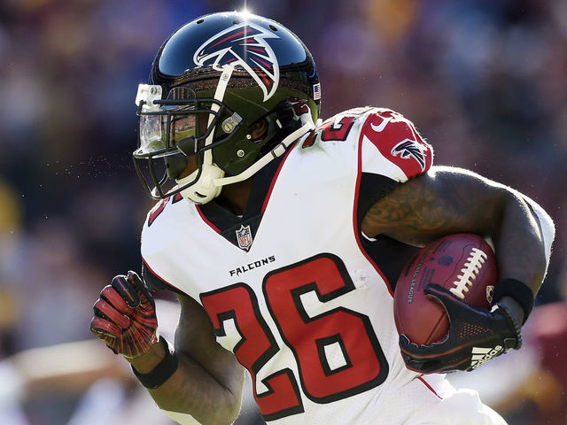 LANDOVER, MD - NOVEMBER 04: Running back Tevin Coleman #26 of the Atlanta Falcons runs with the ball in the first quarter against the Washington Redskins at FedExField on November 4, 2018 in Landover, Maryland.