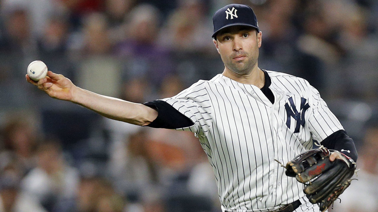 NEW YORK, NY - SEPTEMBER 21: Neil Walker #14 of the New York Yankees throws to first base after fielding a ball at third base in an MLB baseball game against the Baltimore Orioles on September 21, 2018 at Yankee Stadium in the Bronx borough of New York City. Yankees won 10-8.