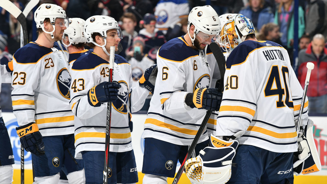 COLUMBUS, OH - JANUARY 29: Marco Scandella #6 and the Buffalo Sabres celebrate with goaltender Carter Hutton #40 of the Buffalo Sabres after defeating the Columbus Blue Jackets 5-4 in a game on January 29, 2019 at Nationwide Arena in Columbus, Ohio.