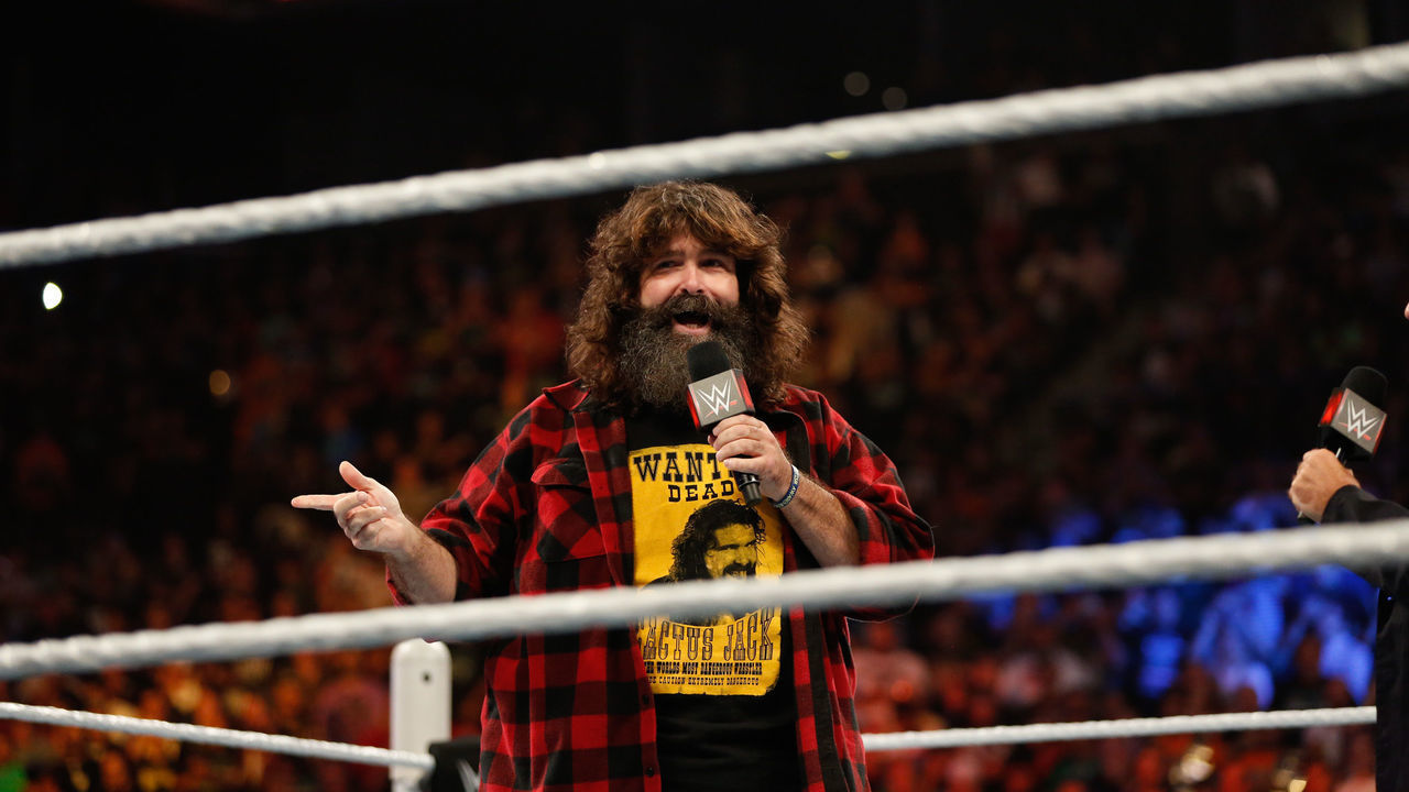 NEW YORK, NY - AUGUST 23: Mick Foley greets the audience at WWE SummerSlam 2015 at Barclays Center of Brooklyn on August 23, 2015 in New York City.