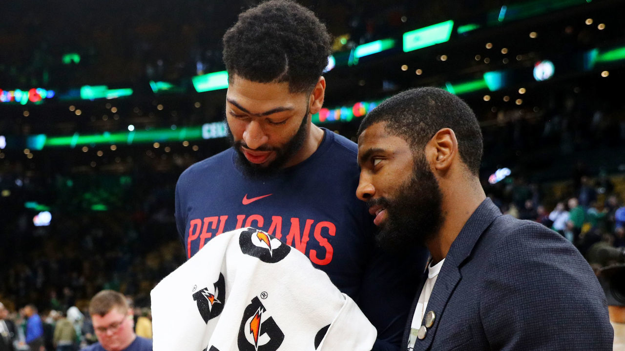 BOSTON, MA - DECEMBER 10: Kyrie Irving #11 of the Boston Celtics and Anthony Davis #23 of the New Orleans Pelicans talk after the game between the Celtics and Pelicans at TD Garden on December 10, 2018 in Boston, Massachusetts.