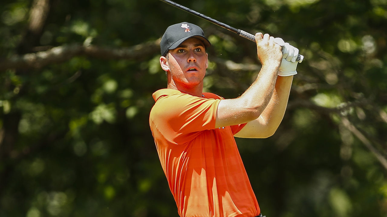 STILLWATER, OK - MAY 30: Matthew Wolff of Oklahoma State tees off while Davis Riley watches on during the Division I Men's Golf Team Match Play Championship held at the Karsten Creek Golf Club on May 30, 2018 in Stillwater, Oklahoma.