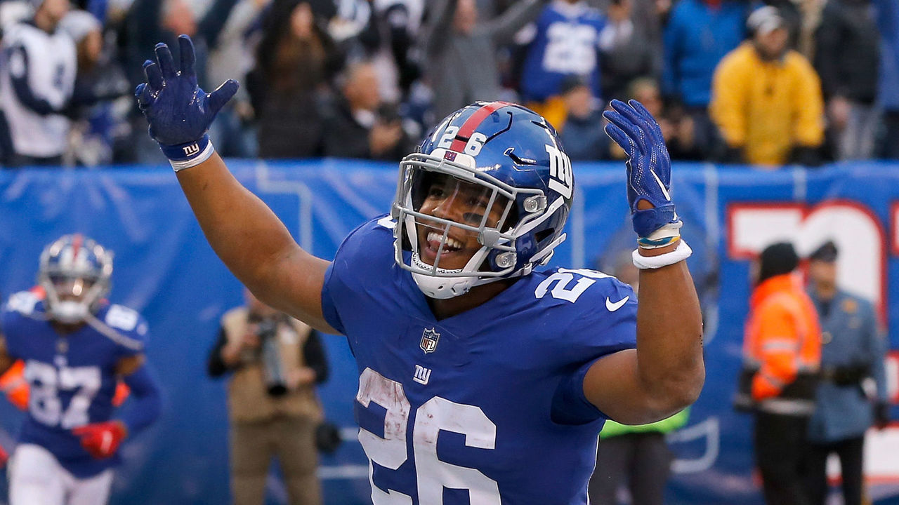 EAST RUTHERFORD, NJ - DECEMBER 30: (NEW YORK DAILIES OUT) Saquon Barkley #26 of the New York Giants celebrates a touchdown against the Dallas Cowboys on December 30, 2018 at MetLife Stadium in East Rutherford, New Jersey. The Cowboys defeated the Giants 36-35.
