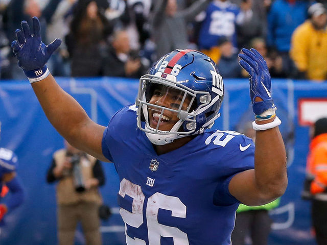 EAST RUTHERFORD, NJ - DECEMBER 30: (NEW YORK DAILIES OUT) Saquon Barkley #26 of the New York Giants celebrates a touchdown against the Dallas Cowboys on December 30, 2018 at MetLife Stadium in East Rutherford, New Jersey. The Cowboys defeated the Giants 36-35.