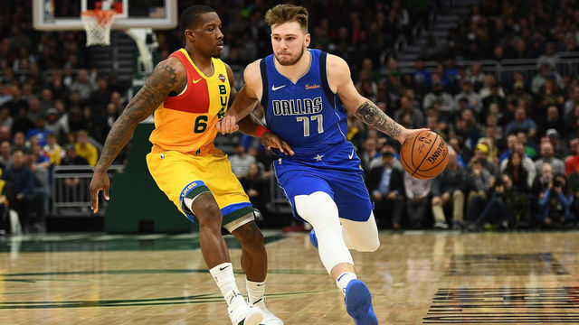 MILWAUKEE, WISCONSIN - JANUARY 21: Luka Doncic #77 of the Dallas Mavericks is defended by Eric Bledsoe #6 of the Milwaukee Bucks during a game at Fiserv Forum on January 21, 2019 in Milwaukee, Wisconsin.