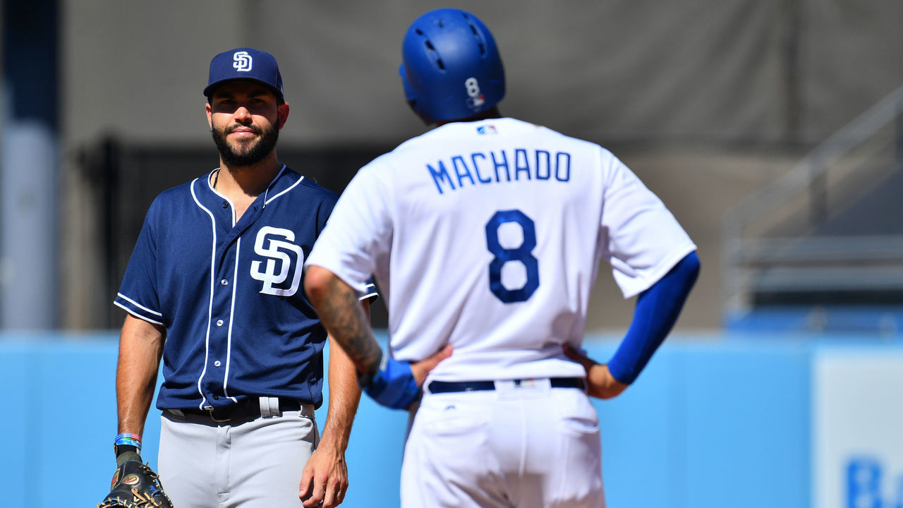 LOS ANGELES, CA - SEPTEMBER 23: San Diego Padres first baseman Eric Hosmer (30) jokes with Los Angeles Dodgers shortstop Manny Machado (8) during a MLB game between the San Diego Padres and the Los Angeles Dodgers on September 23, 2018 at Dodger Stadium in Los Angeles, CA.