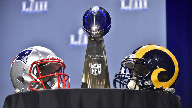 ATLANTA, GA - JANUARY 30: The Vince Lombardi Trophy sits on a table between the New England Patriots and Los Angeles Rams helmets prior to NFL Commissioner Roger Goodell's press conference at the Georgia World Congress Center on January 30, 2019, in Atlanta, GA.