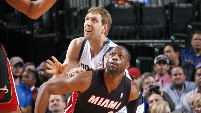 DALLAS, TX - FEBRUARY 18: Dwyane Wade #3 of the Miami Heat defends Dirk Nowitzki #41 of the Dallas Mavericks on February 18, 2014 at the American Airlines Center in Dallas, Texas. Mandatory Copyright Notice: Copyright 2014 NBAE