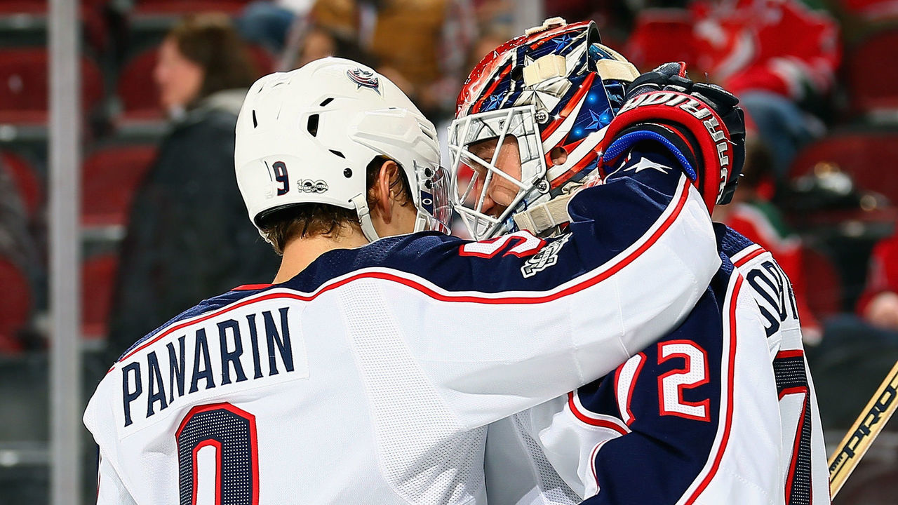 NEWARK, NJ - DECEMBER 08: Winning goaltender Sergei Bobrovsky #72 of the Columbus Blue Jackets is congratulated by Artemi Panarin #9 after defeating the New Jersey Devils 5-3 at Prudential Center on December 8, 2017 in Newark, New Jersey.