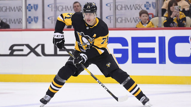 PITTSBURGH, PA - JANUARY 28: Pittsburgh Penguins Center Evgeni Malkin (71) skates with the puck during the second period in the NHL game between the Pittsburgh Penguins and the New Jersey Devils on January 28, 2019, at PPG Paints Arena in Pittsburgh, PA.