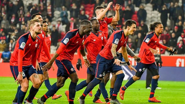 Lille's players celebrate at the end of the French L1 football match between Lille and Nice at The 'Pierre Mauroy' Stadium in Villeneuve d'Ascq, northern France on February 1, 2019.