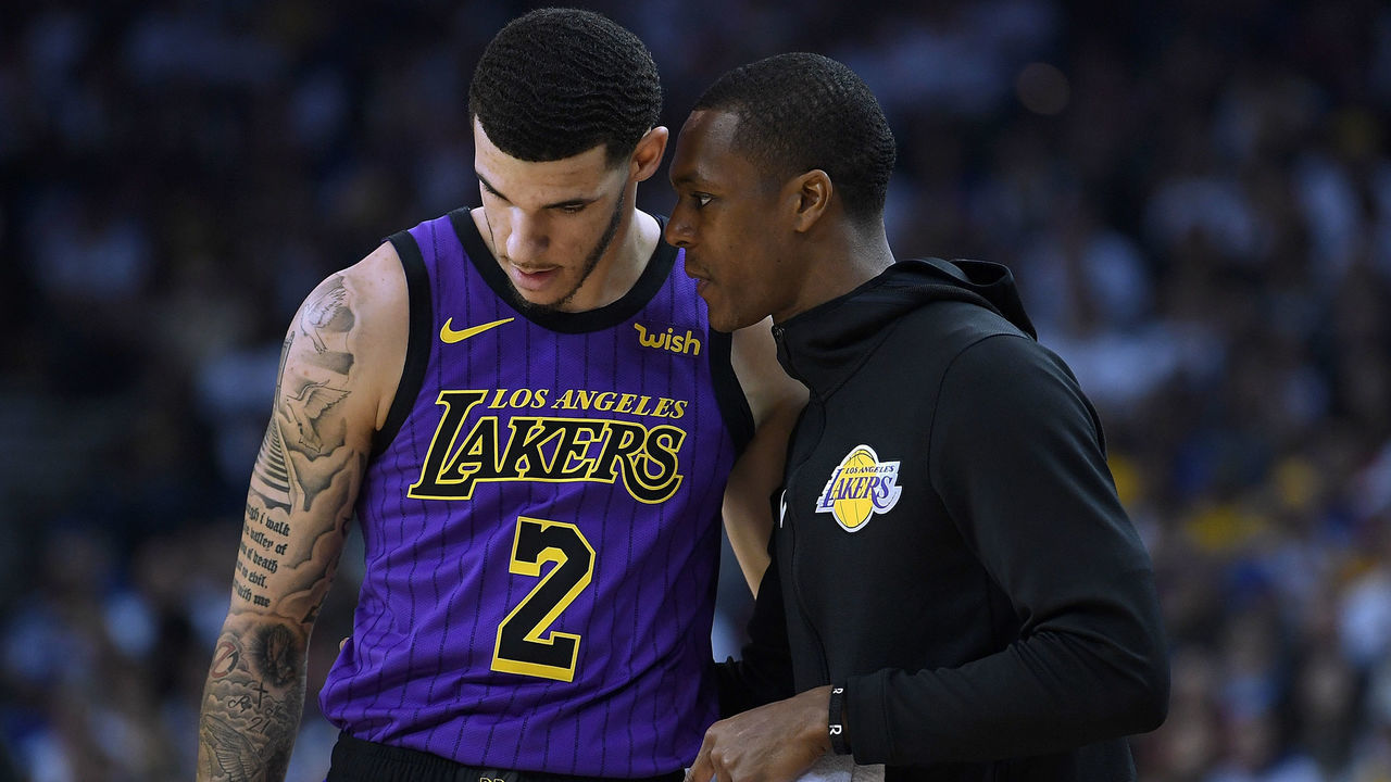 OAKLAND, CA - DECEMBER 25: Lonzo Ball #2 of the Los Angeles Lakers listens to teammate Rajon Rondo #9 against the Golden State Warriors during the first half of their NBA Basketball game at ORACLE Arena on December 25, 2018 in Oakland, California.