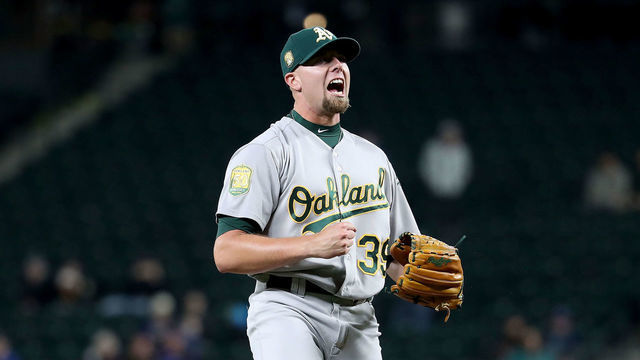 SEATTLE, WA - SEPTEMBER 24: Blake Treinen #39 of the Oakland Athletics celebrates after defeating the Seattle Mariners 7-3 during their game at Safeco Field on September 24, 2018 in Seattle, Washington.