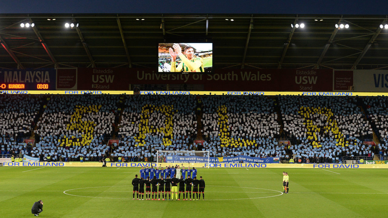 CARDIFF, WALES - FEBRUARY 02: Cardiff City and Bournemouth players line up for minutes reflection for missing Cardiff City player Emiliano Sala during the Premier League match between Cardiff City and AFC Bournemouth at Cardiff City Stadium on February 2, 2019 in Cardiff, United Kingdom.
