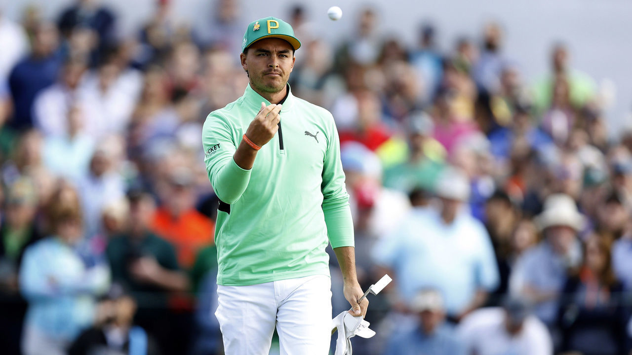 SCOTTSDALE, ARIZONA - FEBRUARY 02: Rickie Fowler tosses his ball to his caddie on the second green during the third round of the Waste Management Phoenix Open at TPC Scottsdale on February 02, 2019 in Scottsdale, Arizona.