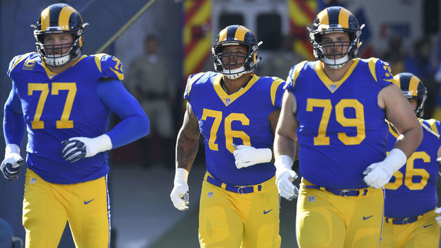 LOS ANGELES, CA - DECEMBER 30: Andrew Whitworth #77, Rodger Saffold #76 and Rob Havenstein #79 of the Los Angeles Rams enter the field to play San Francisco 49ers at Los Angeles Memorial Coliseum on December 30, 2018 in Los Angeles, California. Rams won 48-32.