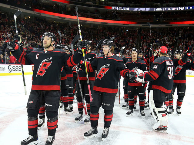 RALEIGH, NC - JANUARY 11: Justin Williams #14 of the Carolina Hurricanes leads the team in a Storm Surge following an NHL game against the Buffalo Sabres on January 11 ,2019 at PNC Arena in Raleigh, North Carolina.