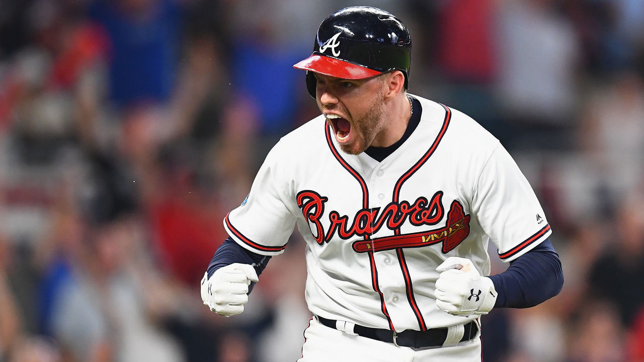 ATLANTA, GA - OCTOBER 07: Freddie Freeman #5 of the Atlanta Braves reacts after hitting a solo home run in the sixth inning against the Los Angeles Dodgers during Game Three of the National League Division Series at SunTrust Park on October 7, 2018 in Atlanta, Georgia.