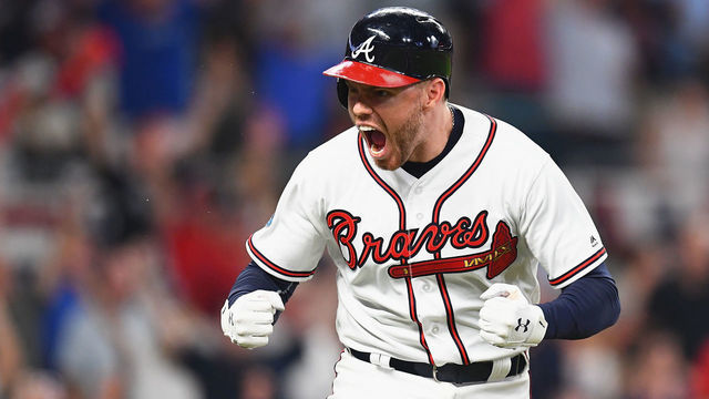 ATLANTA, GA - OCTOBER 07: Freddie Freeman #5 of the Atlanta Braves reacts after hitting a solo home run in the sixth inning against the Los Angeles Dodgers during Game Three of the National League Division Series at SunTrust Park on October 7, 2018 in Atlanta, Georgia.