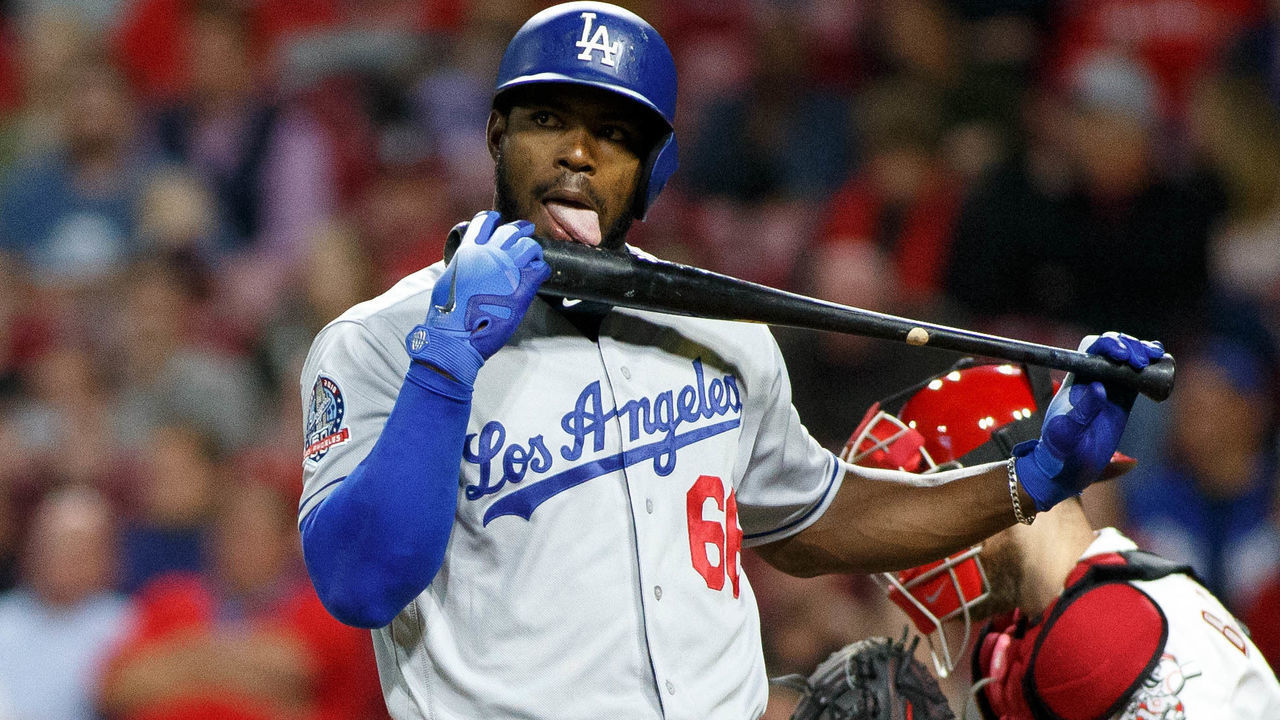 CINCINNATI, OH - SEPTEMBER 10: Yasiel Puig #66 of the Los Angeles Dodgers licks his bat in the game against the Cincinnati Reds at Great American Ball Park on September 10, 2018 in Cincinnati, Ohio.
