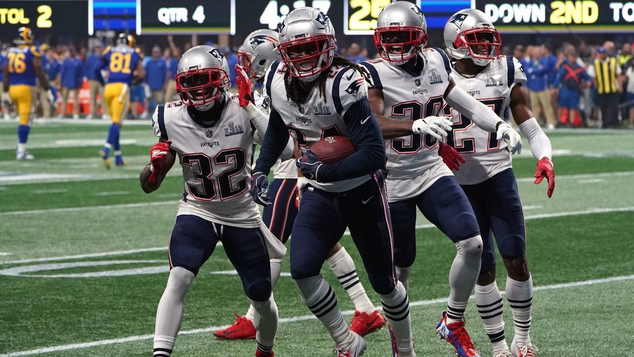 Cornerback for the New England Patriots Stephon Gilmore (C) celebrates with teammates after an interception during Super Bowl LIII between the New England Patriots and the Los Angeles Rams at Mercedes-Benz Stadium in Atlanta, Georgia, on February 3, 2019.