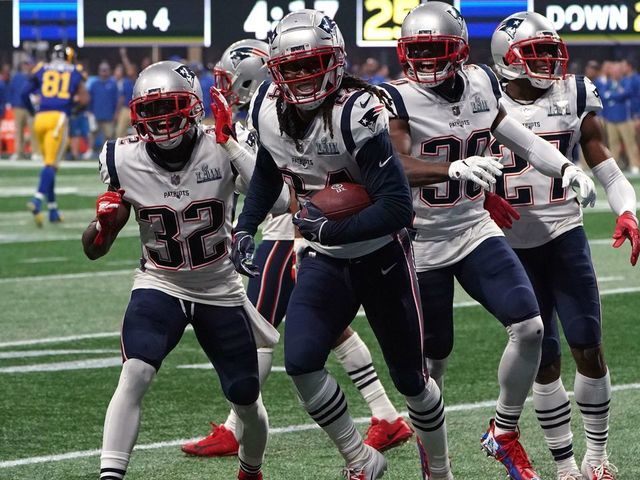 Cornerback for the New England Patriots Stephon Gilmore (C) celebrates with teammates after an interception during Super Bowl LIII between the New England Patriots and the Los Angeles Rams at Mercedes-Benz Stadium in Atlanta, Georgia, on February 3, 2019.