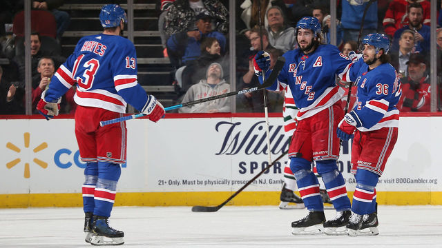 NEWARK, NJ - JANUARY 31: Mika Zibanejad #93 of the New York Rangers celebrates scoring a first period goal against the New Jersey Devils with teammates Kevin Hayes #13 and Mats Zuccarello #36 at the Prudential Center on January 31, 2019 in Newark, New Jersey.