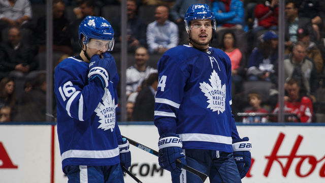 TORONTO, ON - JANUARY 23: Auston Matthews #34 of the Toronto Maple Leafs talks with teammate Mitch Marner #16 after a whistle during the third period against the Washington Capitals at the Scotiabank Arena on January 23, 2019 in Toronto, Ontario, Canada.