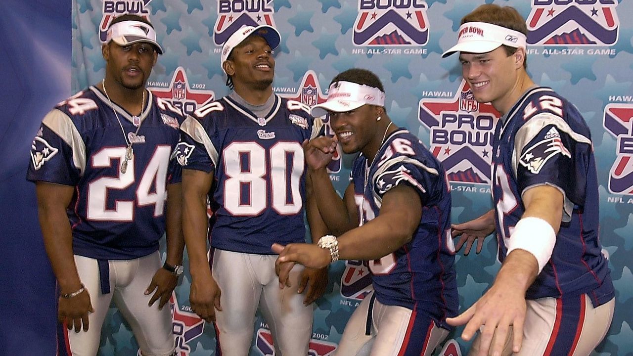 NEW ORLEANS, UNITED STATES: AFC Champions New England Patriots players (L to R) Ty Law, Troy Brown, Lawyer Milloy, and Tom Brady strike a pose for photographers during the team's photo and interview day 29 January 2002 at the Louisiana Superdome in New Orleans. The Patriots will take on the NFC Champions St. Louis Rams in Super Bowl XXXVI on 03 February. AFP PHOTO/Roberto SCHMIDT