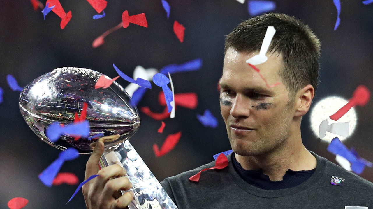 HOUSTON, TX - FEBRUARY 05: Tom Brady #12 of the New England Patriots raises the Vince Lombardi trophy after the Patriots defeat the Atlanta Falcons 34-28 in overtime of Super Bowl 51 at NRG Stadium on February 5, 2017 in Houston, Texas.