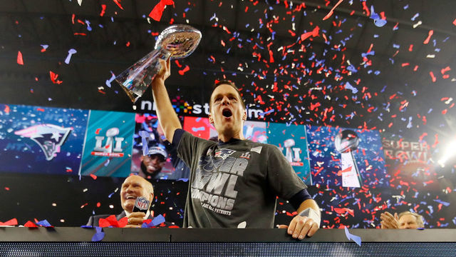 HOUSTON, TX - FEBRUARY 05: Tom Brady #12 of the New England Patriots celebrates with the Vince Lombardi Trophy after defeating the Atlanta Falcons during Super Bowl 51 at NRG Stadium on February 5, 2017 in Houston, Texas. The Patriots defeated the Falcons 34-28.