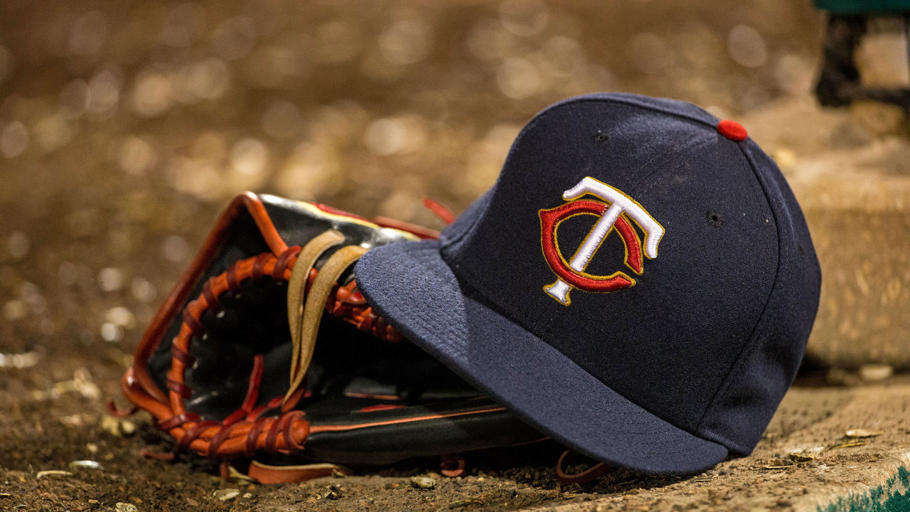 FORT MYERS, FL- MARCH 05: A Minnesota Twins hat and glove during a Grapefruit League spring training game against the Boston Red Sox on March 5, 2015 at the CenturyLink Sports Complex in Fort Myers, Florida.