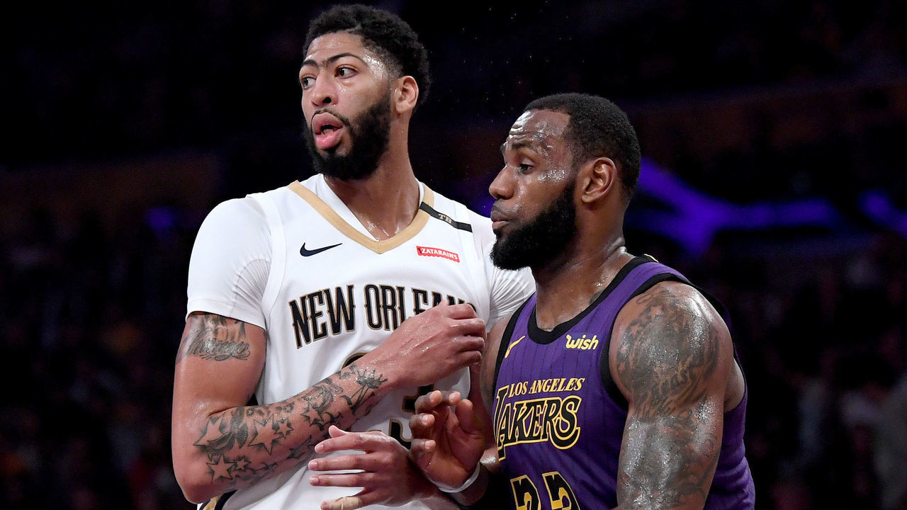 LOS ANGELES, CALIFORNIA - DECEMBER 21: LeBron James #23 of the Los Angeles Lakers guards Anthony Davis #23 of the New Orleans Pelicans during a 112-104 Laker win at Staples Center on December 21, 2018 in Los Angeles, California.