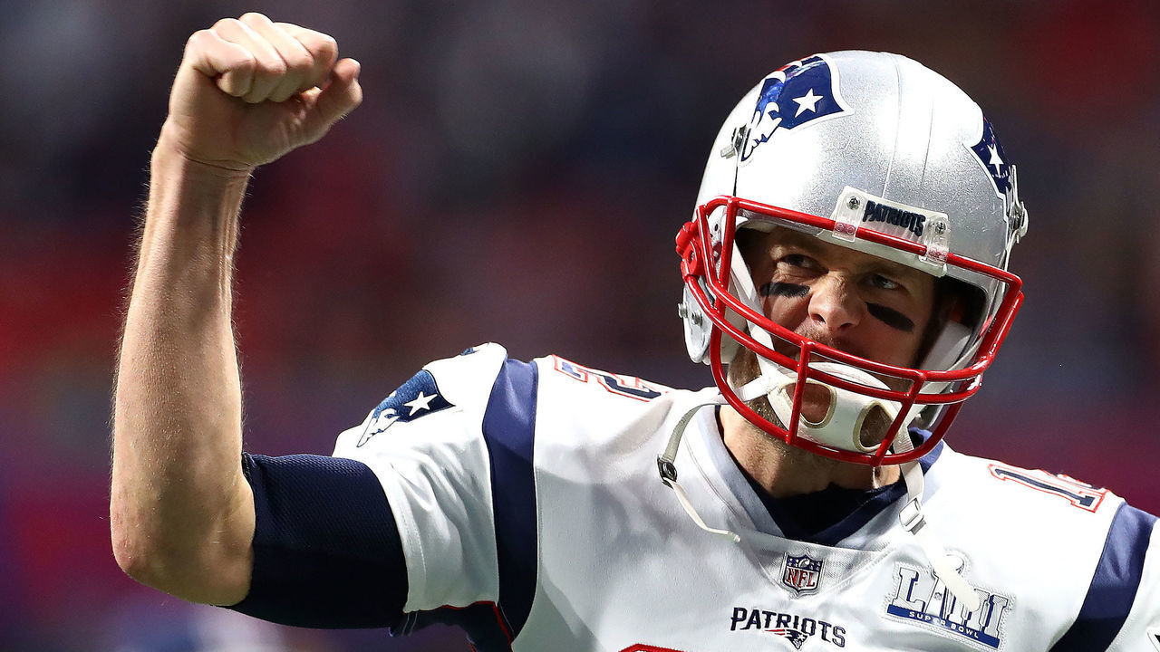 ATLANTA, GEORGIA - FEBRUARY 03: Tom Brady #12 of the New England Patriots pumps his fist running onto the field before Super Bowl LIII against the Los Angeles Rams at Mercedes-Benz Stadium on February 03, 2019 in Atlanta, Georgia.