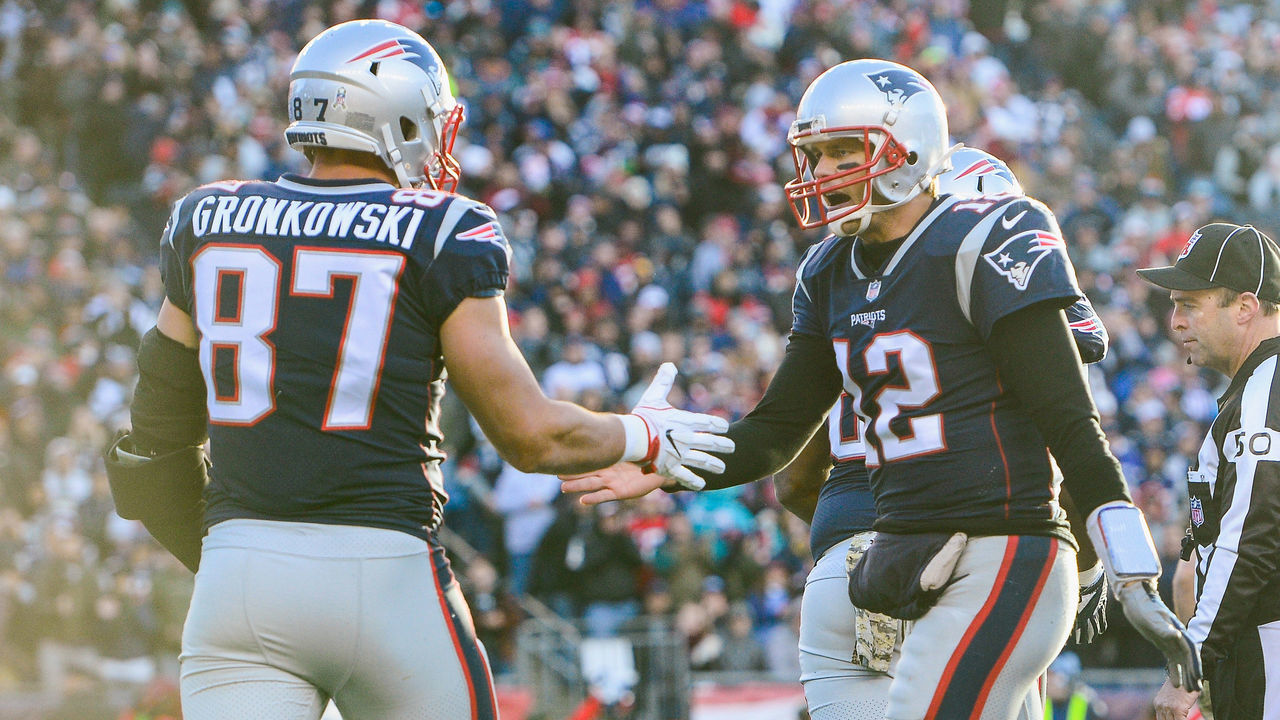 FOXBORO, MA - NOVEMBER 26: Rob Gronkowski #87 of the New England Patriots reacts with Tom Brady #12 after catching a touchdown pass during the third quarter of a game against the Miami Dolphins at Gillette Stadium on November 26, 2017 in Foxboro, Massachusetts.
