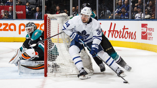 TORONTO, ON - FEBRUARY 4: Auston Matthews #34 of the Toronto Maple Leafs plays the puck against the Anaheim Ducks during the third period at the Scotiabank Arena on February 4, 2019 in Toronto, Ontario, Canada.
