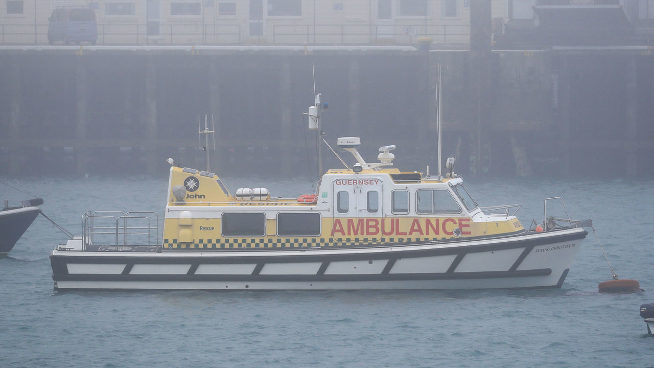 The St John Marine Ambulance, Flying Christine III, shrouded in fog as it is moored in Guernsey harbour.