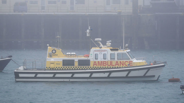 The St John Marine Ambulance, Flying Christine III, shrouded in fog as it is moored in Guernsey harbour.