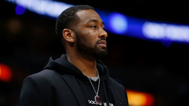 MIAMI, FL - JANUARY 04: John Wall #2 of the Washington Wizards looks on from the bench against the Miami Heat at American Airlines Arena on January 4, 2019 in Miami, Florida.