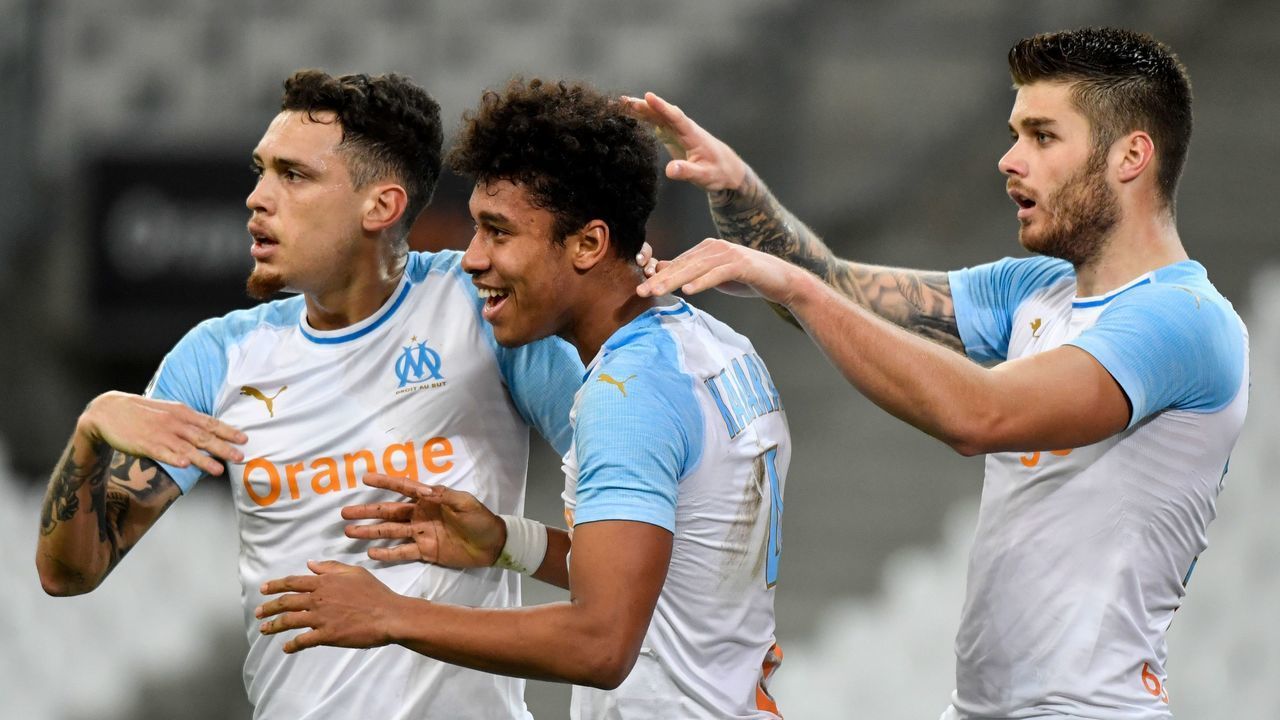 Marseille's French defender Boubacar Kamara celebrates with Marseille's Argentine midfielder Lucas Ocampos (L) and Marseille's Croatian defender Duje Caleta Car (R) after scoring a goal during the French L1 football match between Olympique de Marseille and FC Girondins de Bordeaux at the Velodrome stadium in Marseille onFebruary 5, 2019.