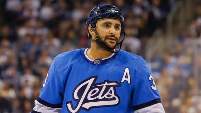 WINNIPEG, MB - DECEMBER 29: Dustin Byfuglien #33 of the Winnipeg Jets looks on during a second period stoppage in play against the Minnesota Wild at the Bell MTS Place on December 29, 2018 in Winnipeg, Manitoba, Canada. The Wild defeated the Jets 3-1.