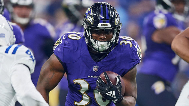 INDIANAPOLIS, IN - AUGUST 20: Baltimore Ravens running back Kenneth Dixon (30) runs with the football in game action during the preseason NFL game between the Indianapolis Colts and the Baltimore Ravens on August 20, 2018 at Lucas Oil Stadium in Indianapolis, Indiana.